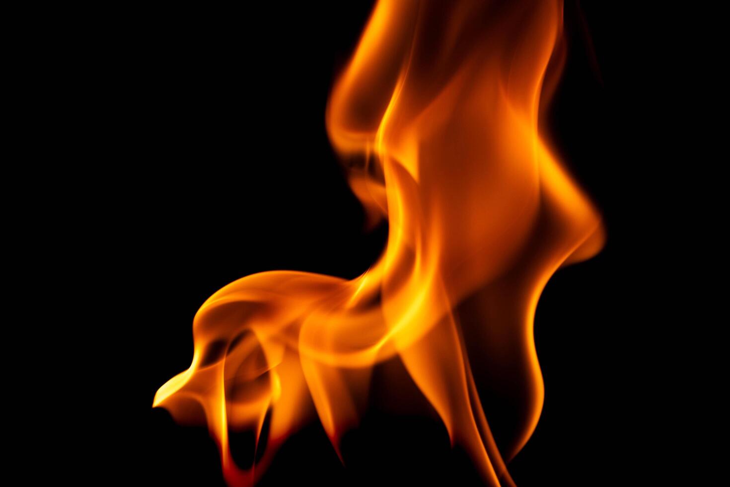 Hot flames on a black background. Beautiful flame of fire in the dark. Abstract of burning flames and smoke. photo