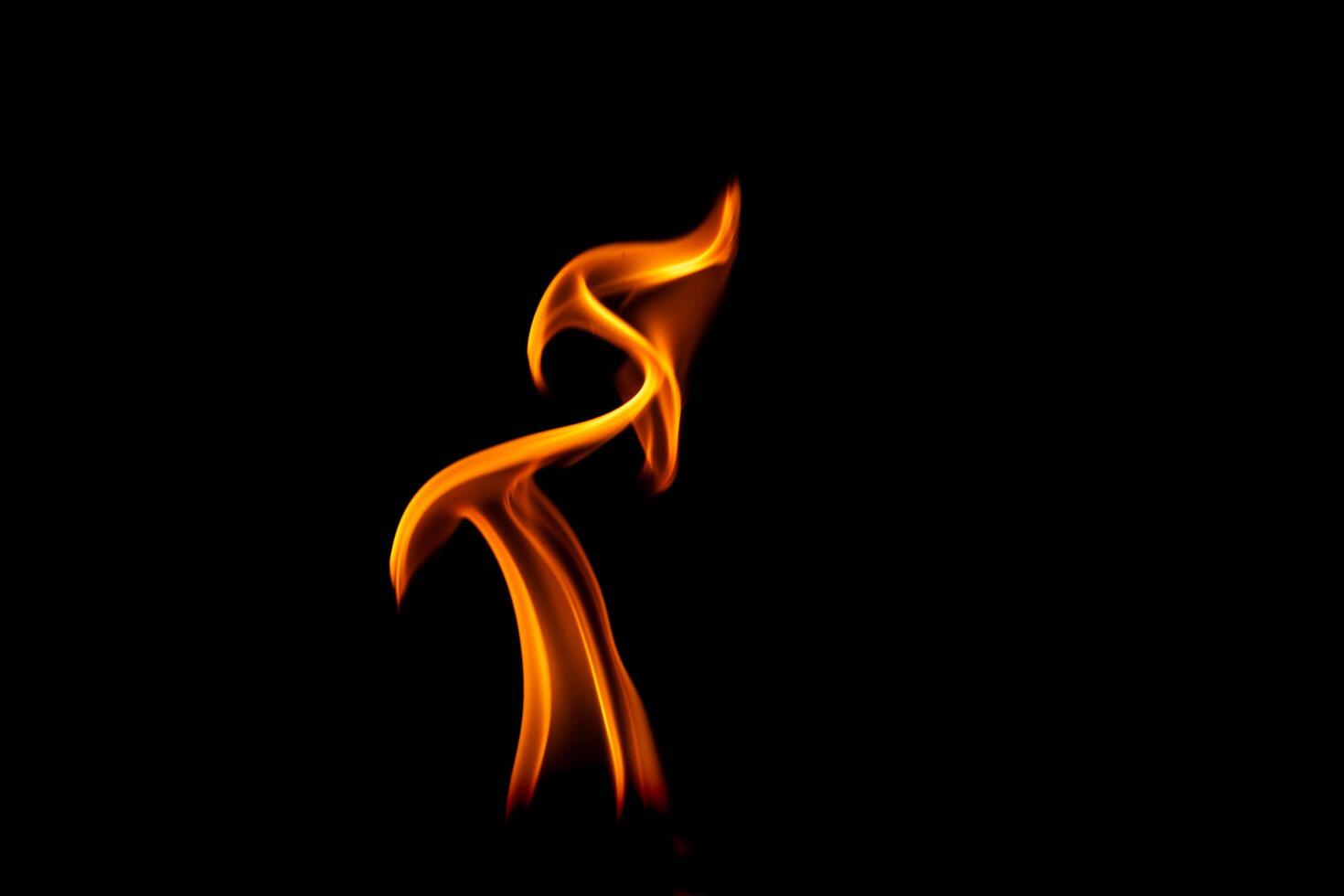 Hot flames on a black background. Beautiful flame of fire in the dark. Abstract of burning flames and smoke. photo