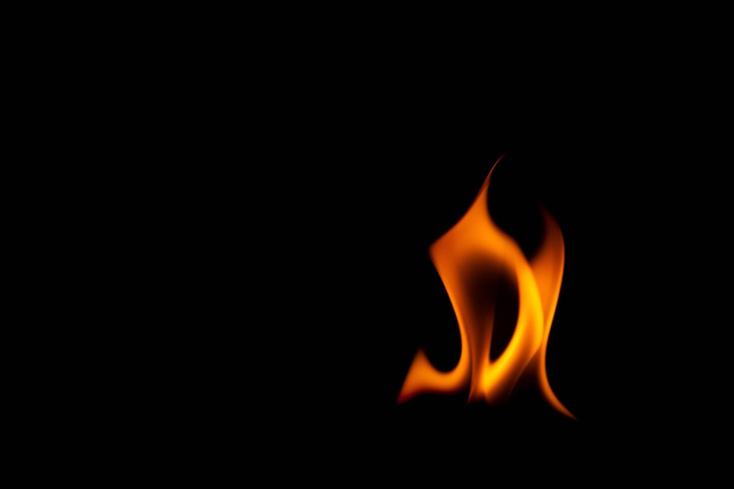 Hot flames on a black background. Beautiful flame of fire in the dark. Abstract of burning flames and smoke. photo