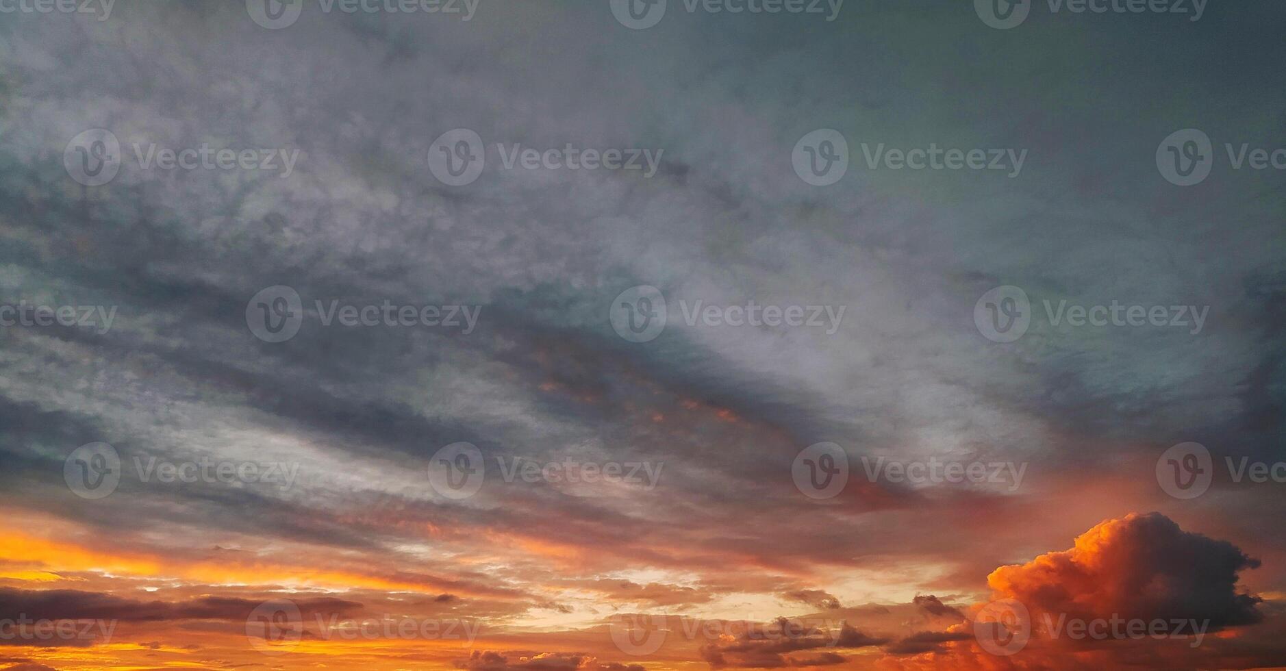 Landscape epic dark blue sky at sunset with orange clouds. photo