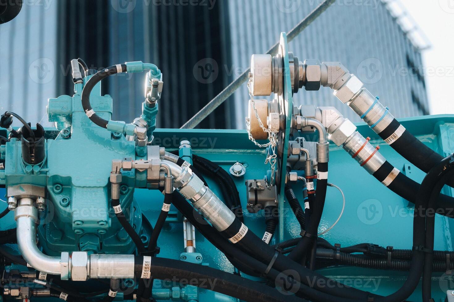 Hydraulic crane engine.The control system of the crane engine.Lifting hydraulic Department on the truck crane.The hydraulic system of the engine.hydraulic hoses on the crane.autoparts photo