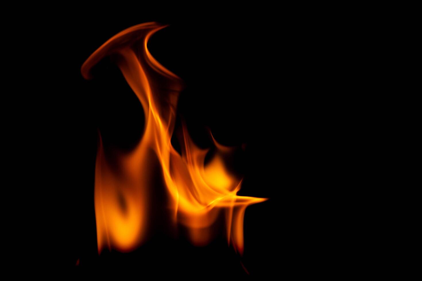 Hot flames on a black background. Beautiful flame of fire in the dark. Abstract of burning flames and smoke. photo