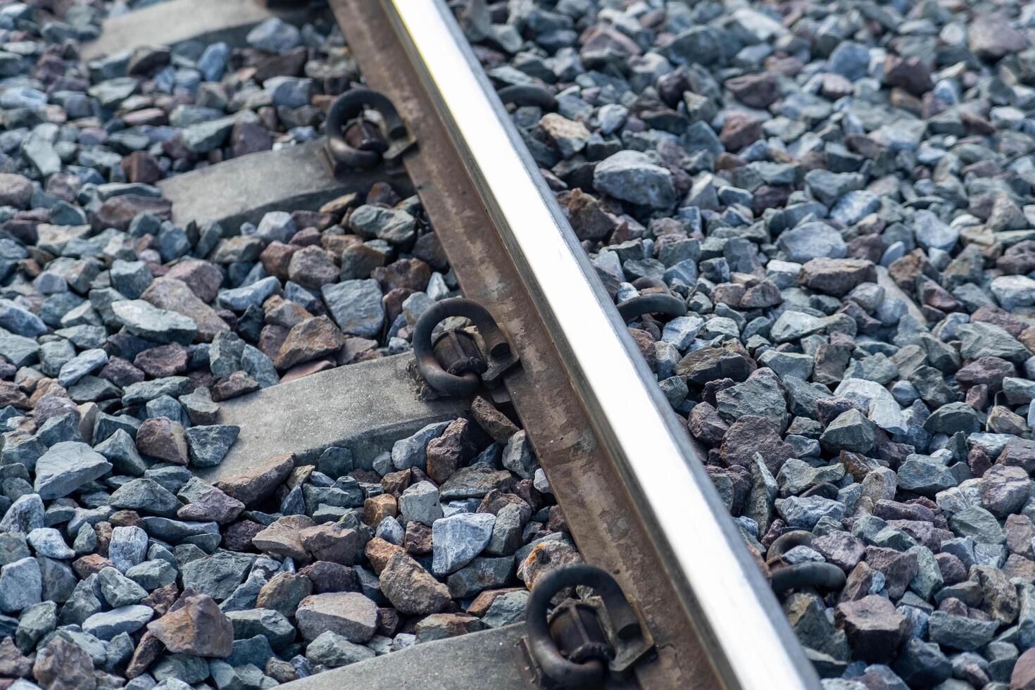 Train tracks in rural scene. Railroad in the park. vintage railroad close up. photo