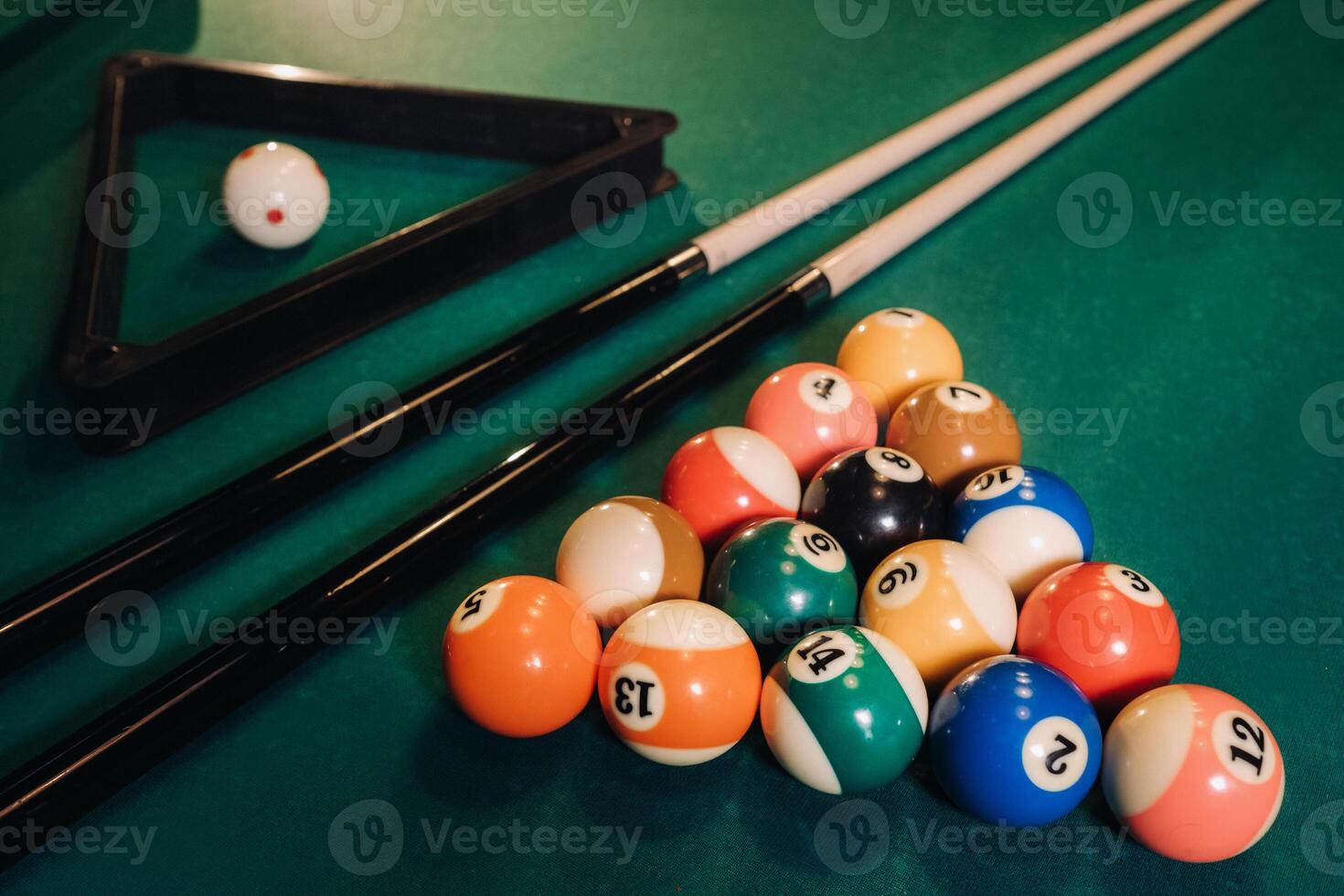 Billiard table with green surface and balls in the billiard club.Pool Game photo