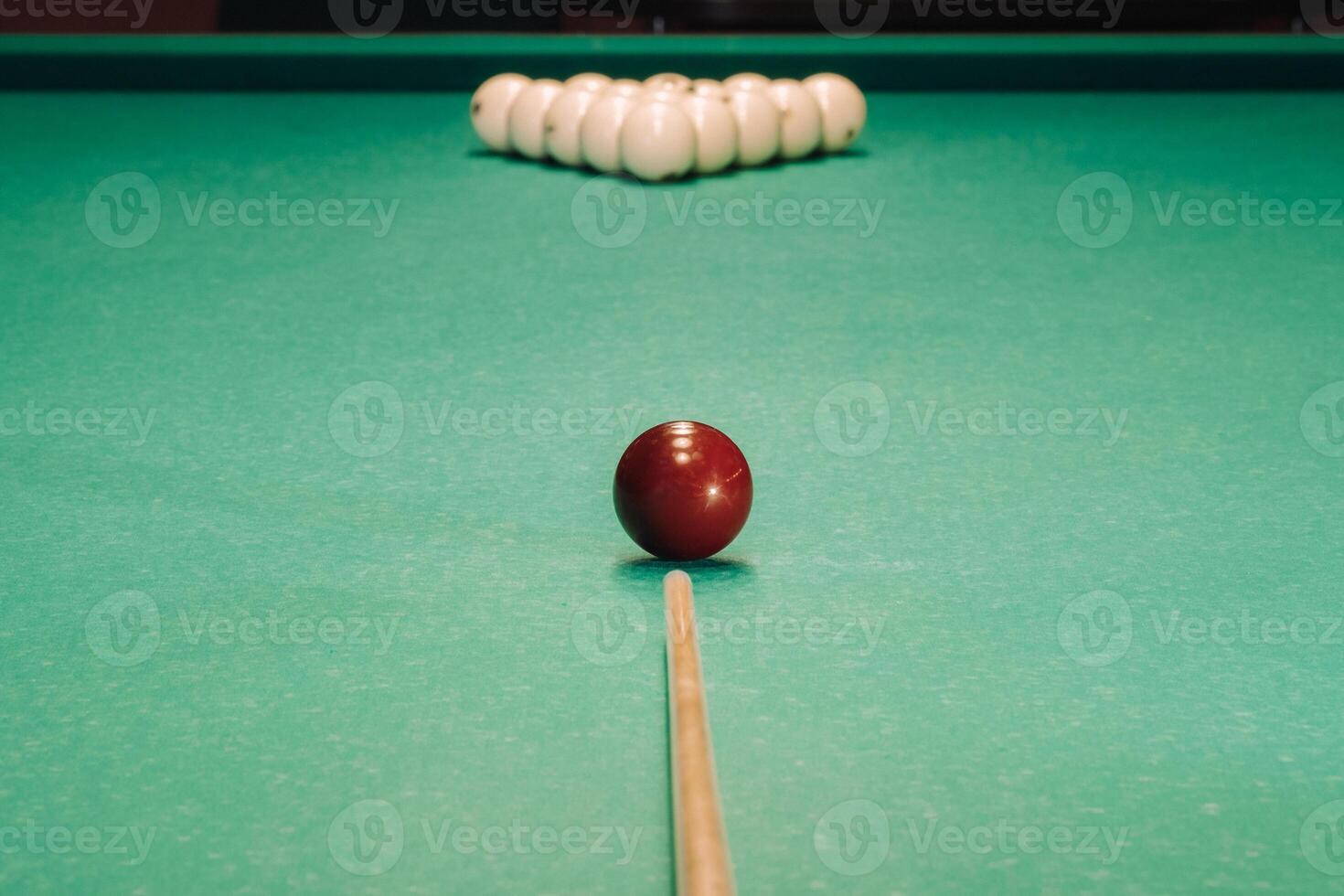 Start of the game of billiards on the green table.The balls are arranged in a triangle on the table photo