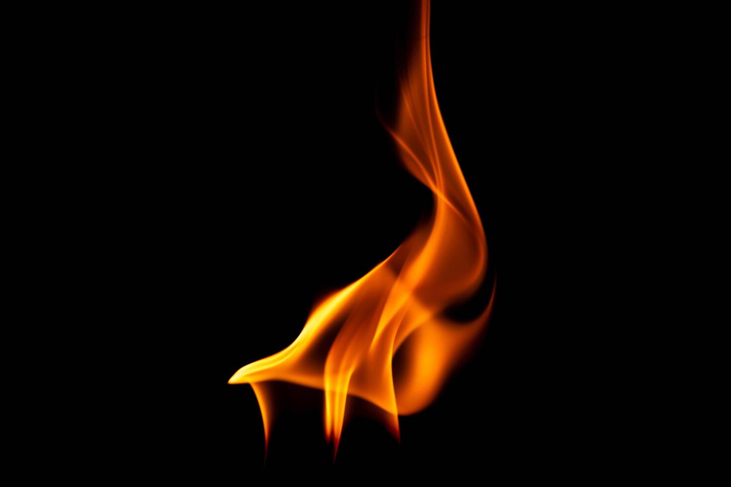 Hot flames on a black background. Beautiful flame of fire in the dark. Abstract of burning flames and smoke. photo