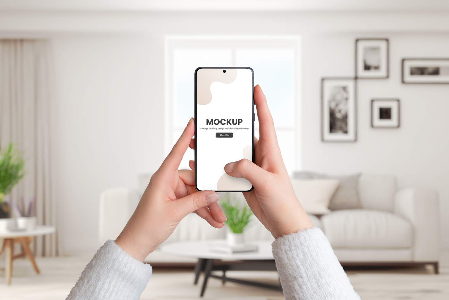 Woman's hands hold a smartphone mockup in a living room interior psd