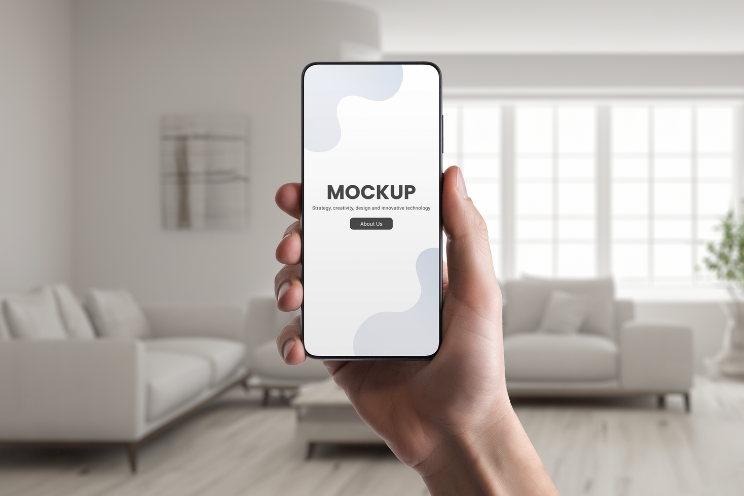 Phone mockup in hand with real estate interior in background psd