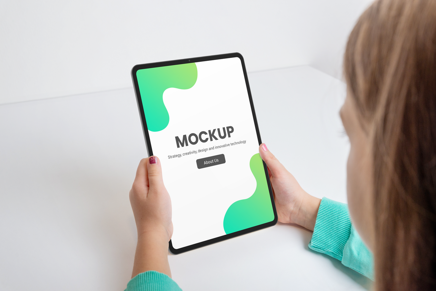 Vertical tablet held by a girl on a work desk mockup psd