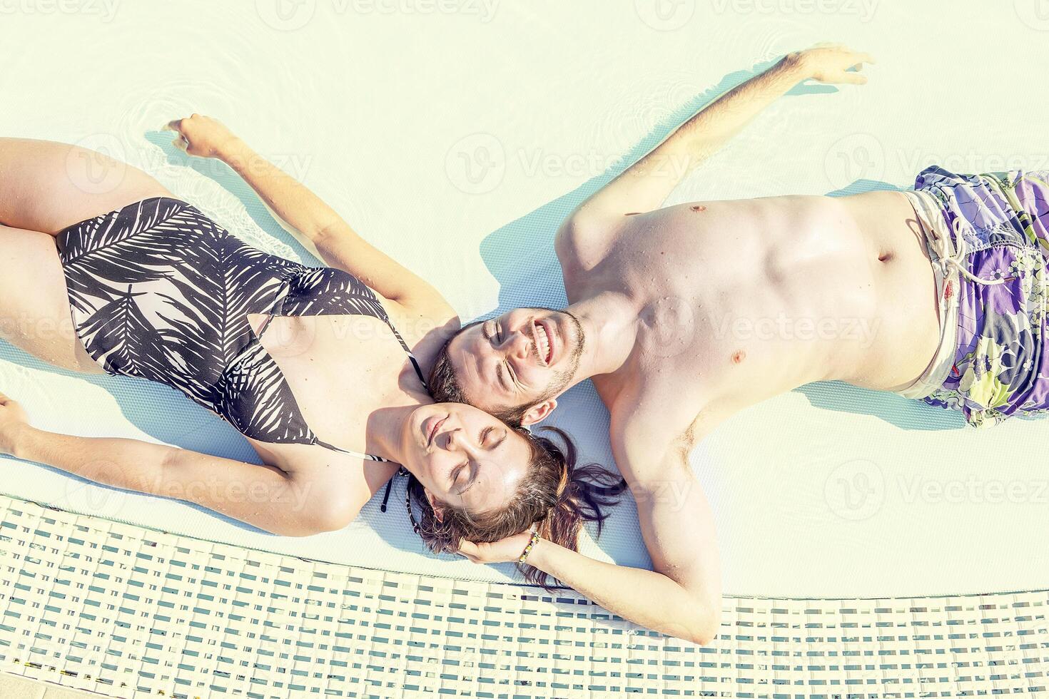 Young loving couple relaxes in the hydromassage photo