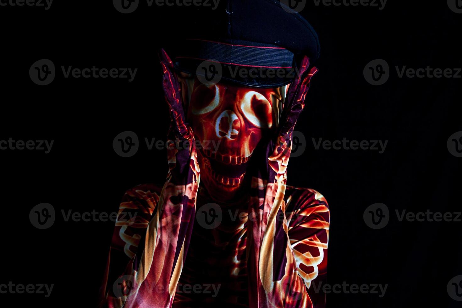 sensual woman dressed in a skeleton costume wearing a policeman's hat photo