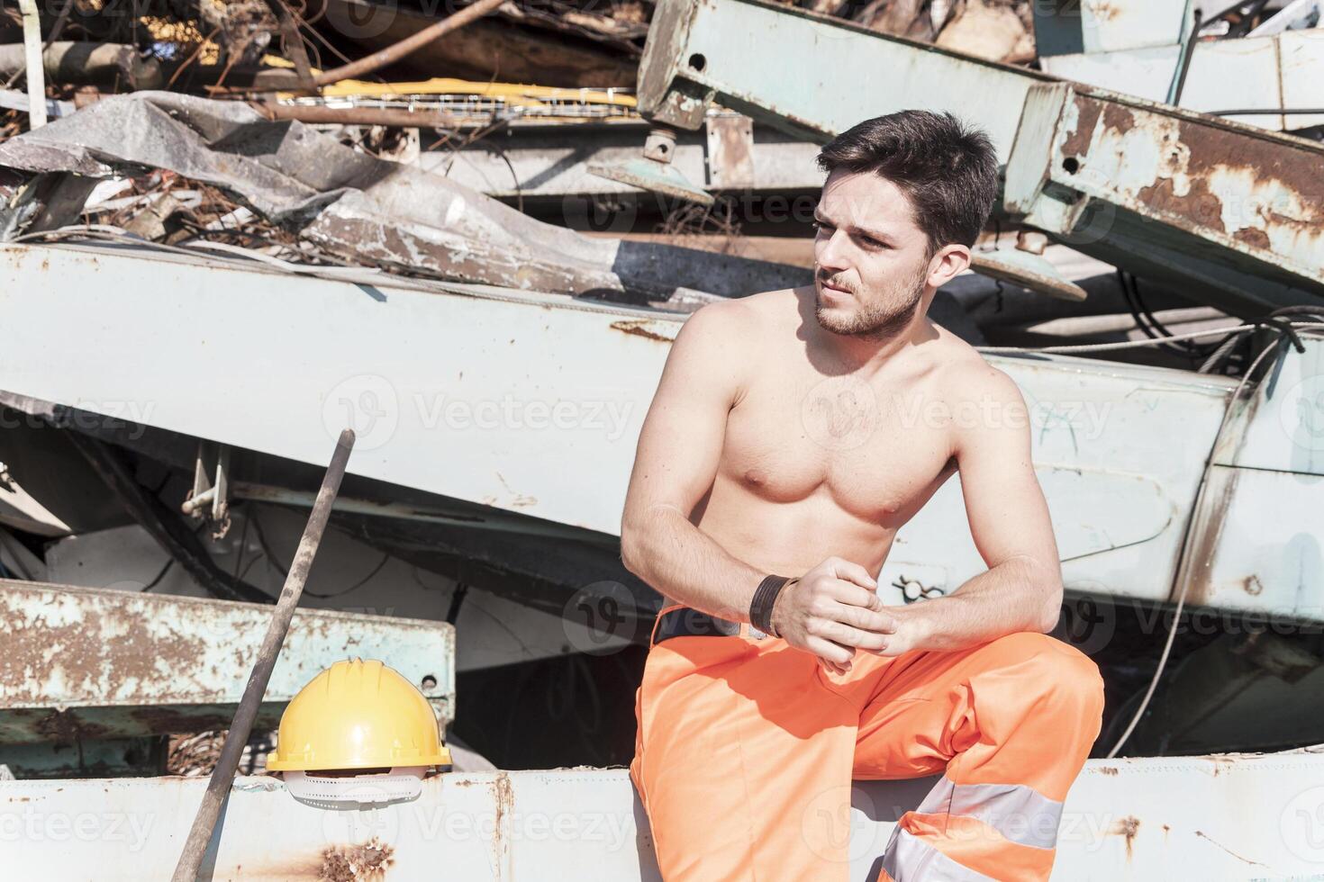 young worker in a junkyard photo