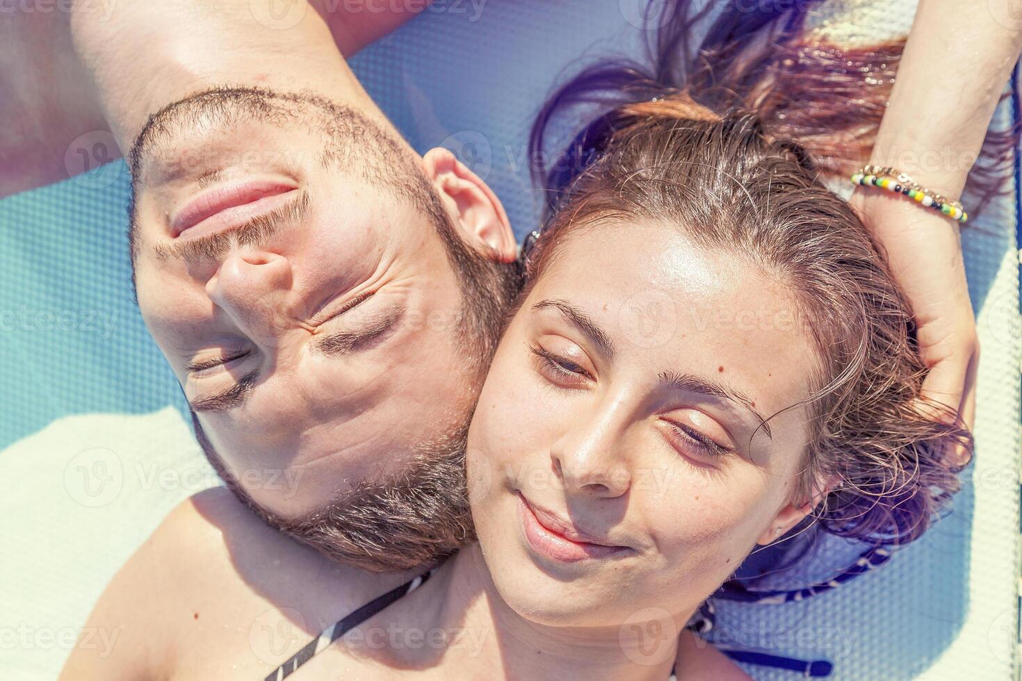Young loving couple relaxes in the hydromassage photo