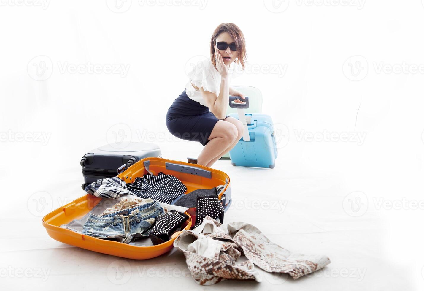 young woman lost the clothes from his suitcase photo