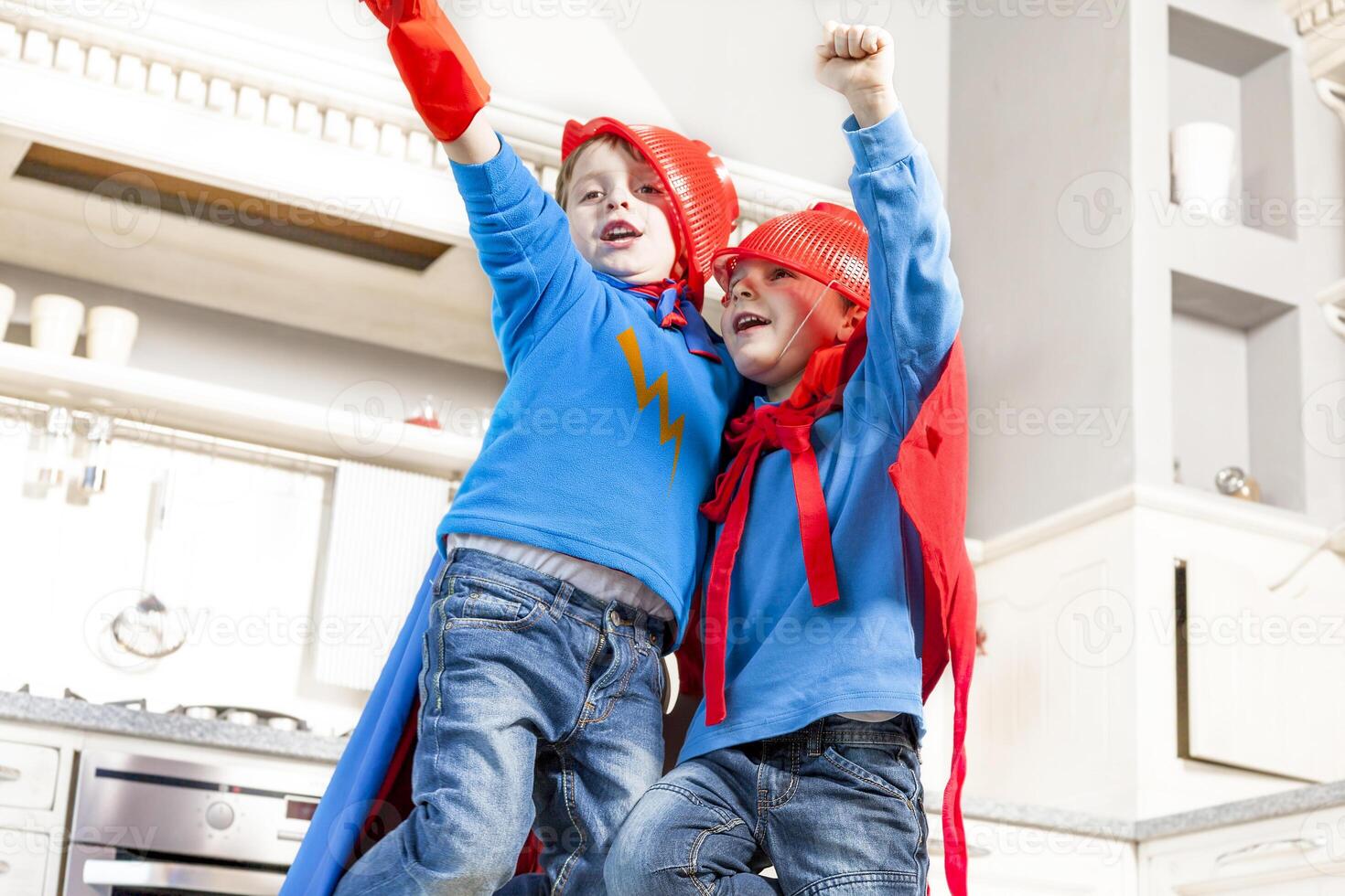 children playing at being wonderful hero photo