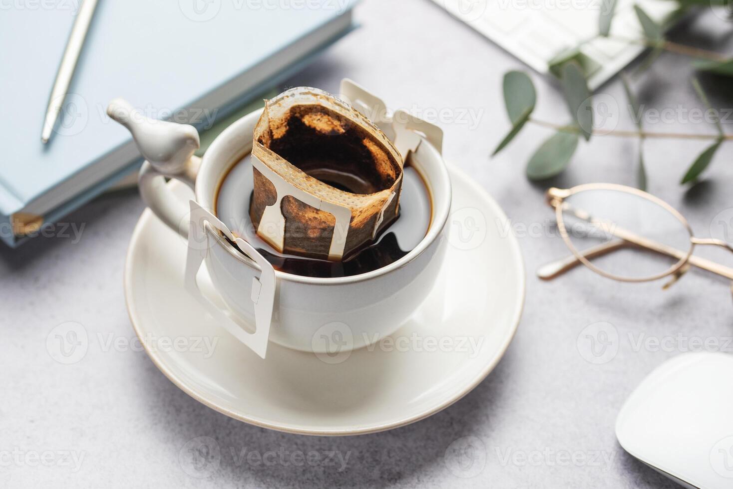 A glass cup of freshly brewed coffee photo