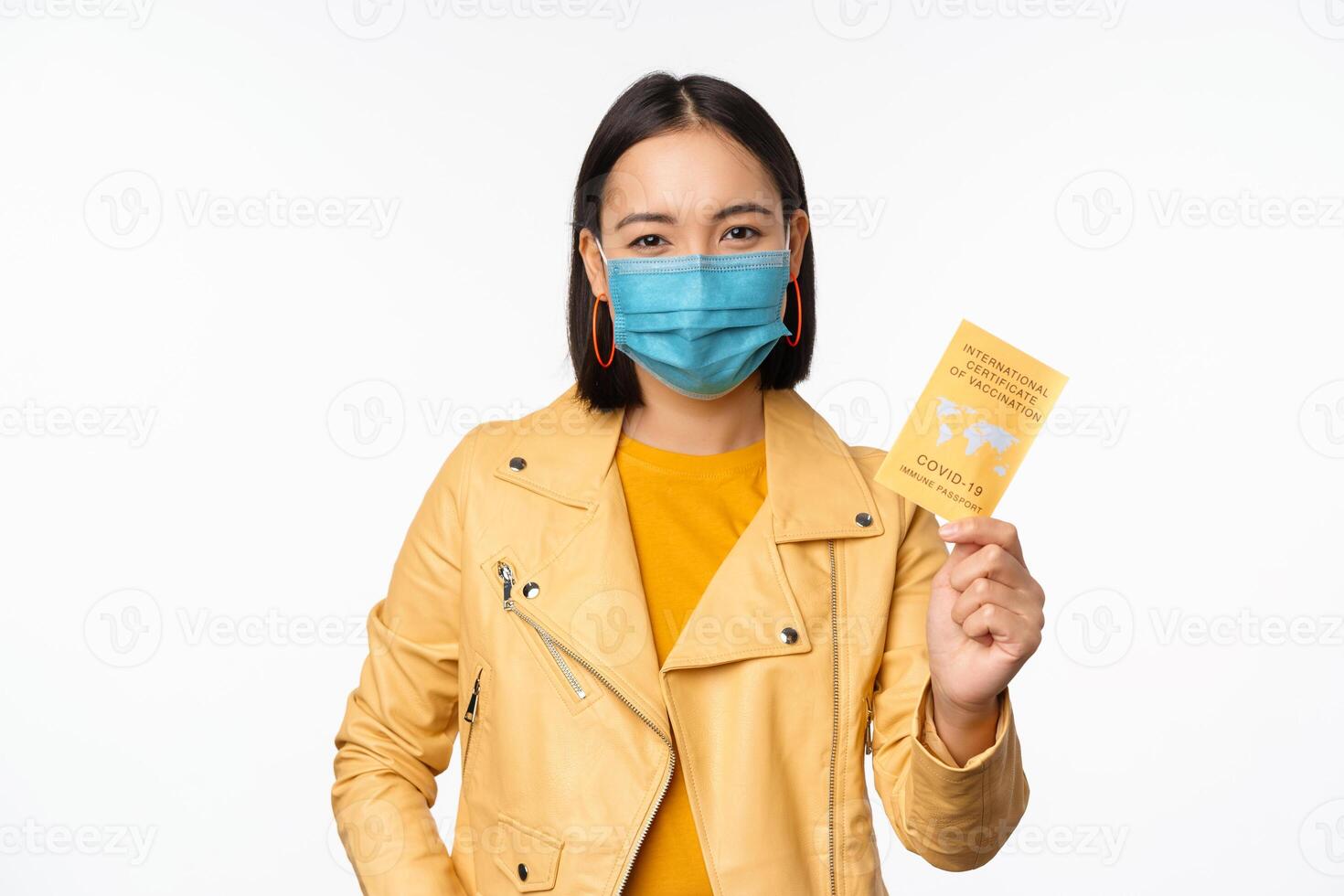 Hey you got point. Cheerful cute asian lively girl dark short haircut pointing camera finger-pistol smiling broadly, encourage friend make move, congratulate coworker good job, stand blue background photo