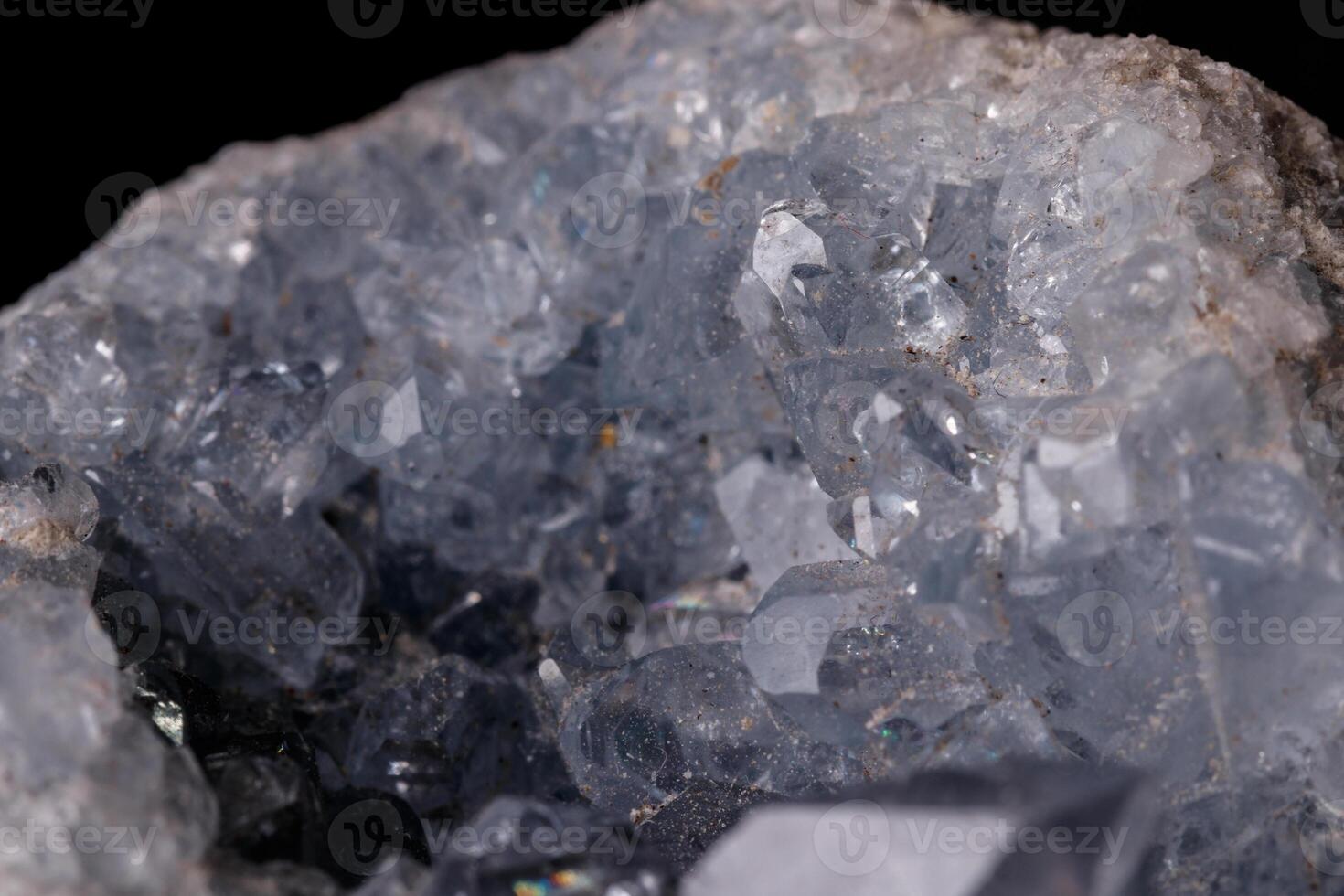 Celestine mineral stone macro on microcline on black background photo
