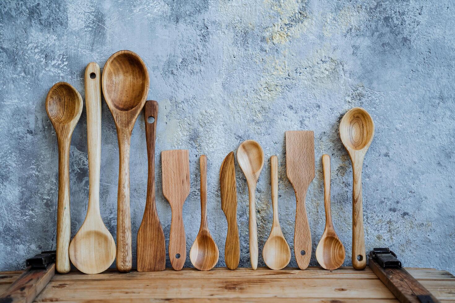 several wooden spoons on the table photo