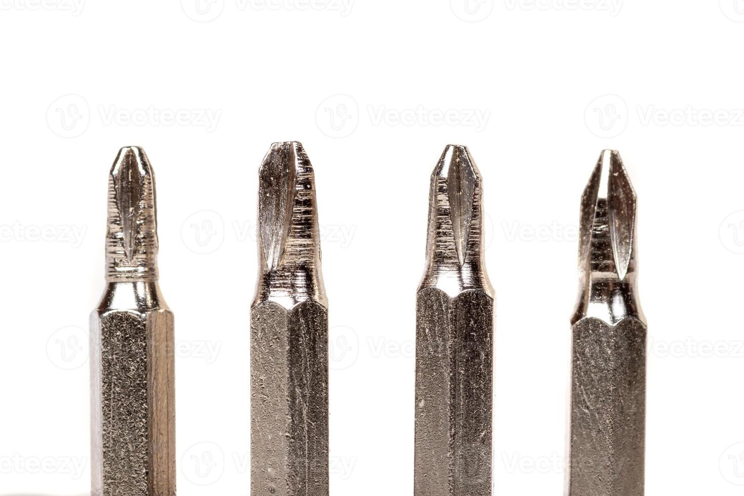 A set of different attachments for a head screwdriver with a screwdriver on a white background photo