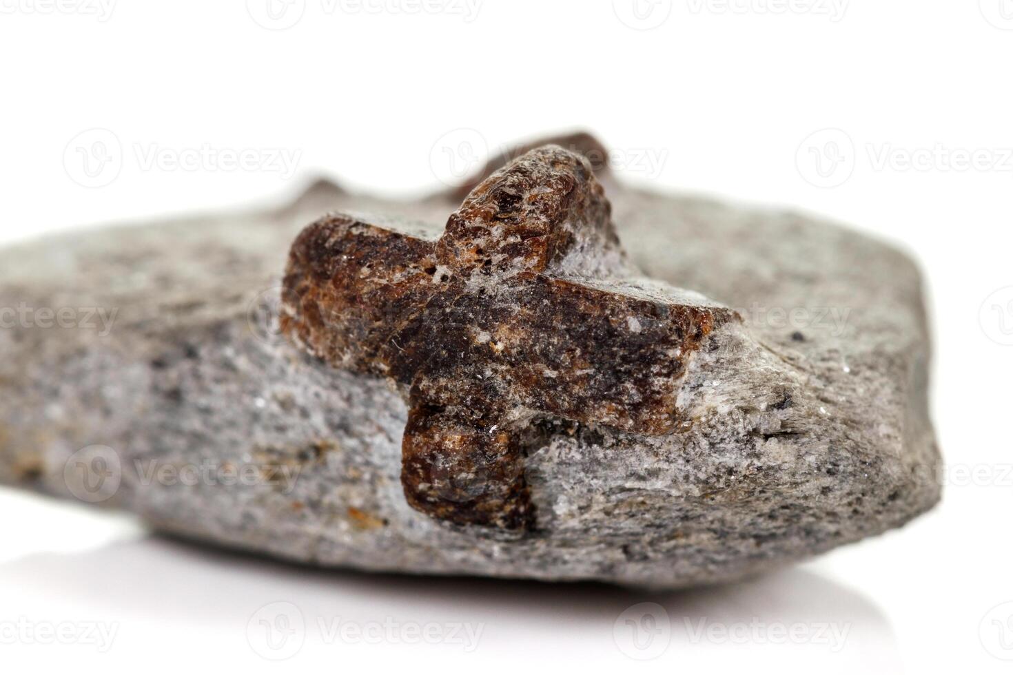 macro mineral stone Staurolite on a white background photo