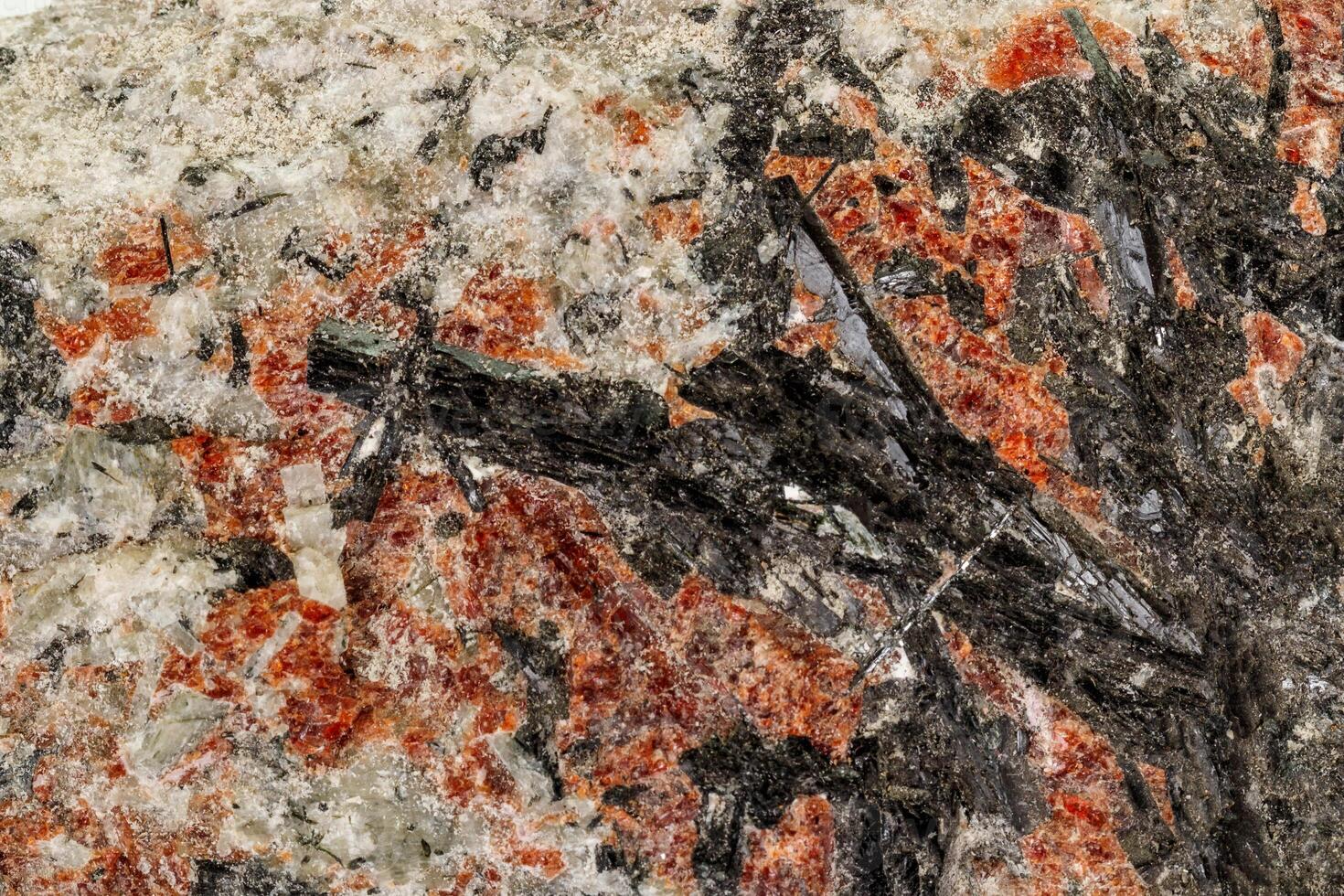 Macro of a stone Stibnite mineral on a white background photo