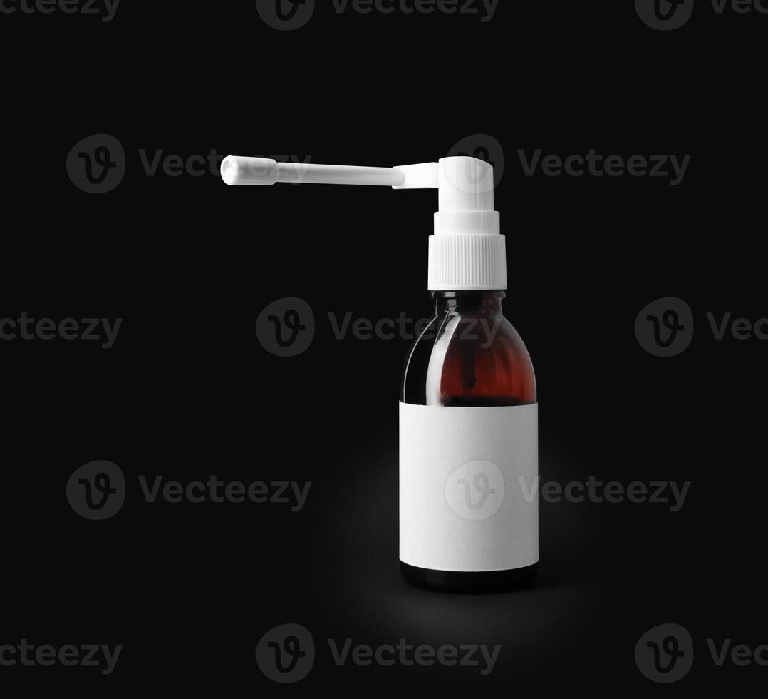 Throast spray medicine isolated on black background. photo