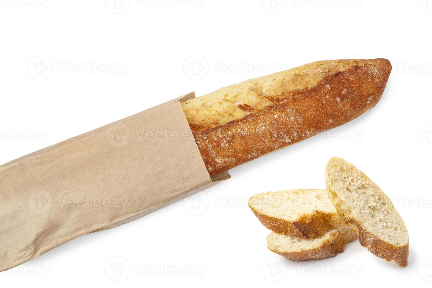 Freshly baked baguette in a paper package photo