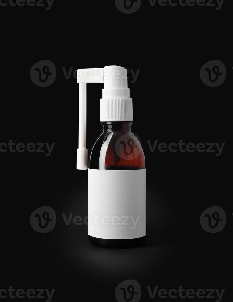 Throast spray medicine isolated on black background. photo