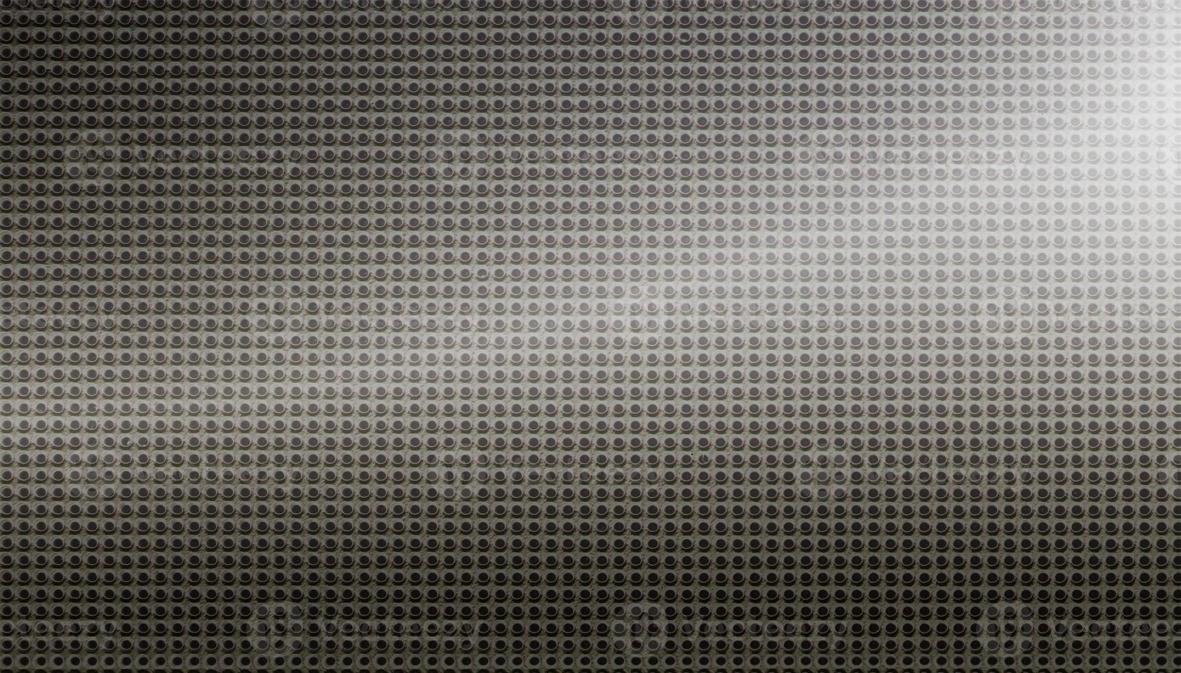 Spot lit perforated metal plate photo