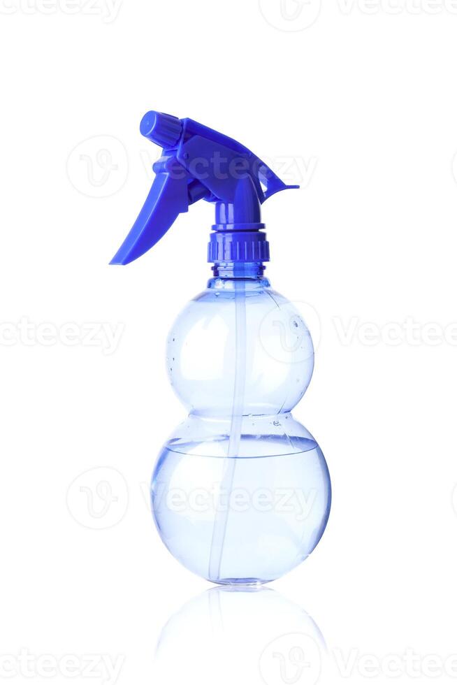 Blue plastic spray bottle isolated on white backgroun photo