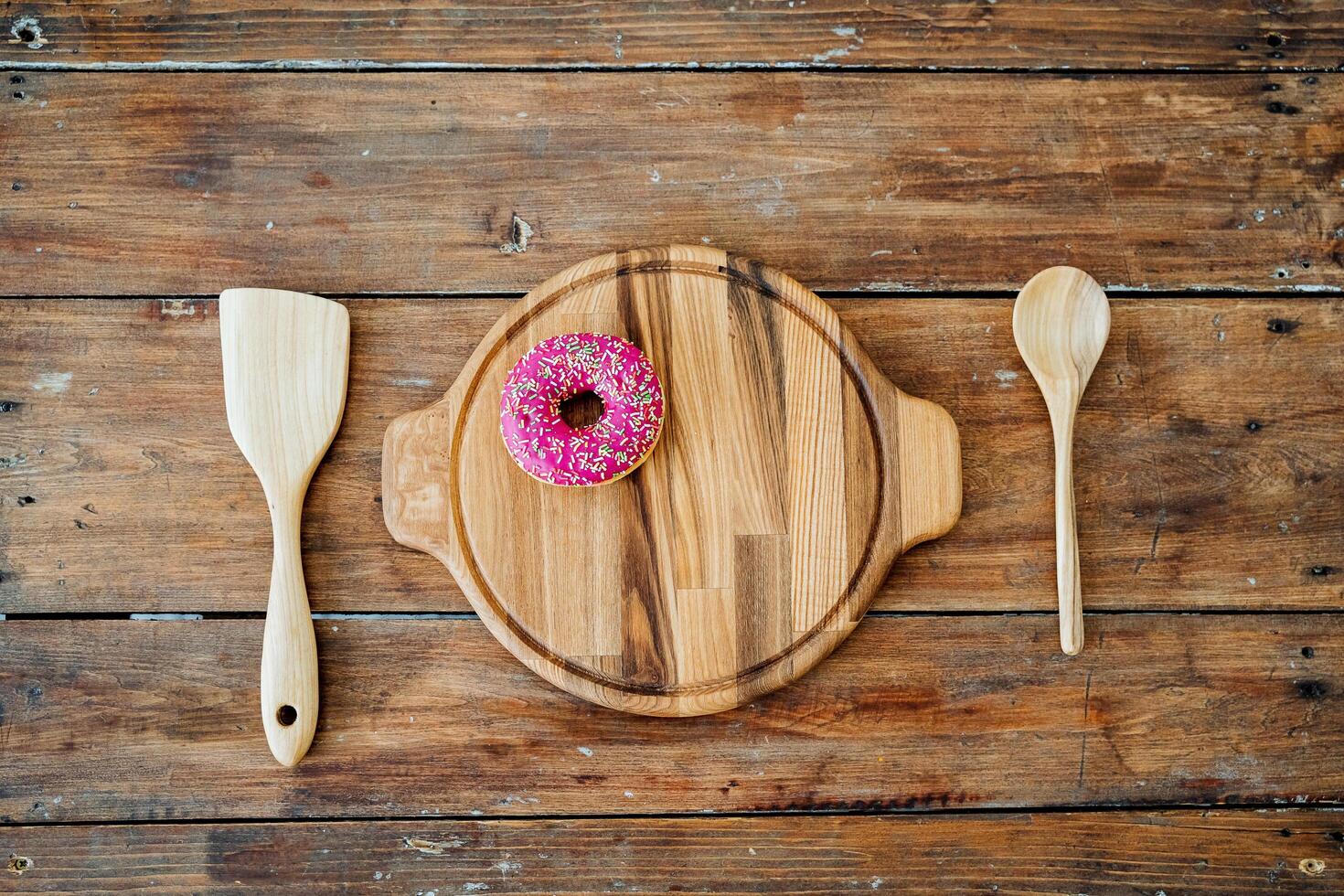 a platter with a pink donut photo