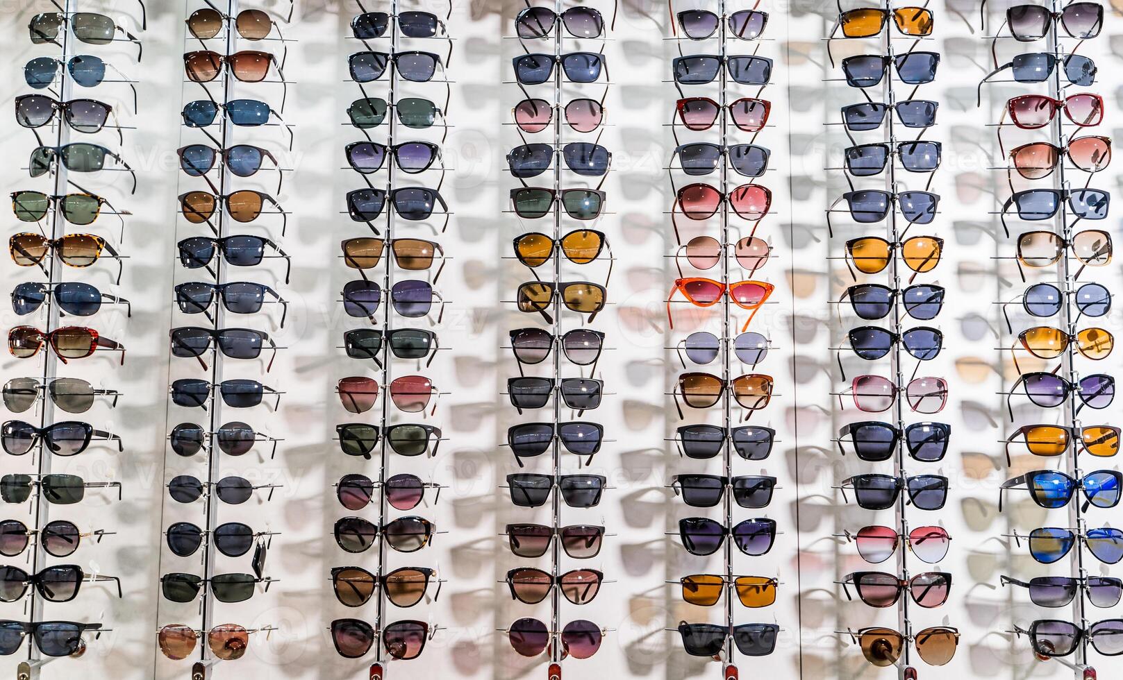Sales rack of sunglasses. A colorful display of sunglasses for sale photo