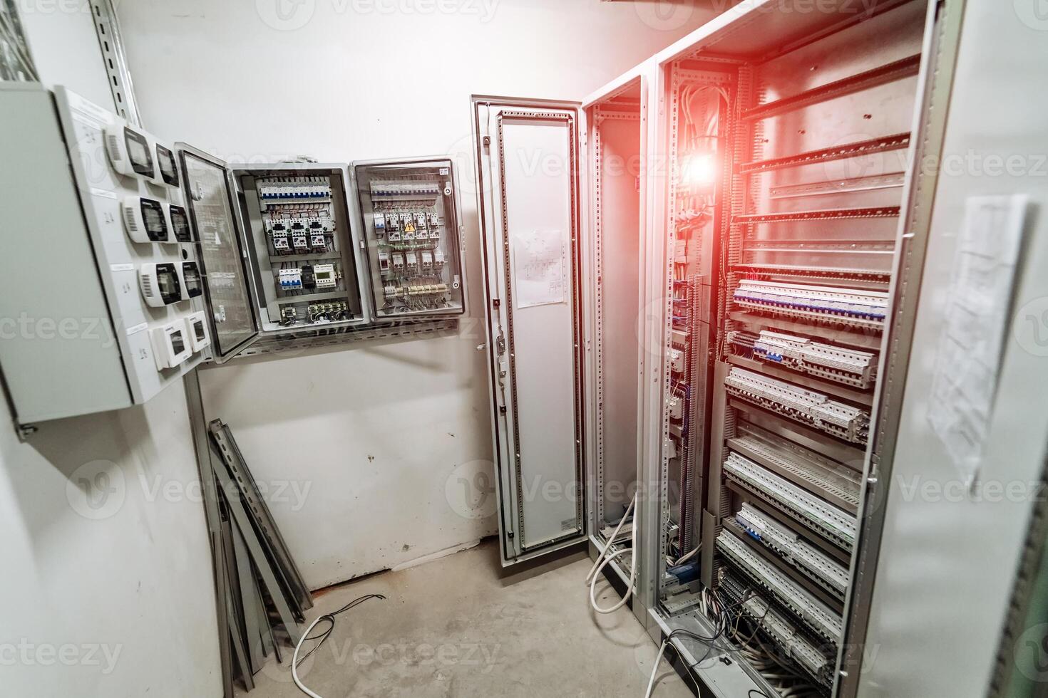 Electrical panel at a assembly line factory. Controls and switches. photo