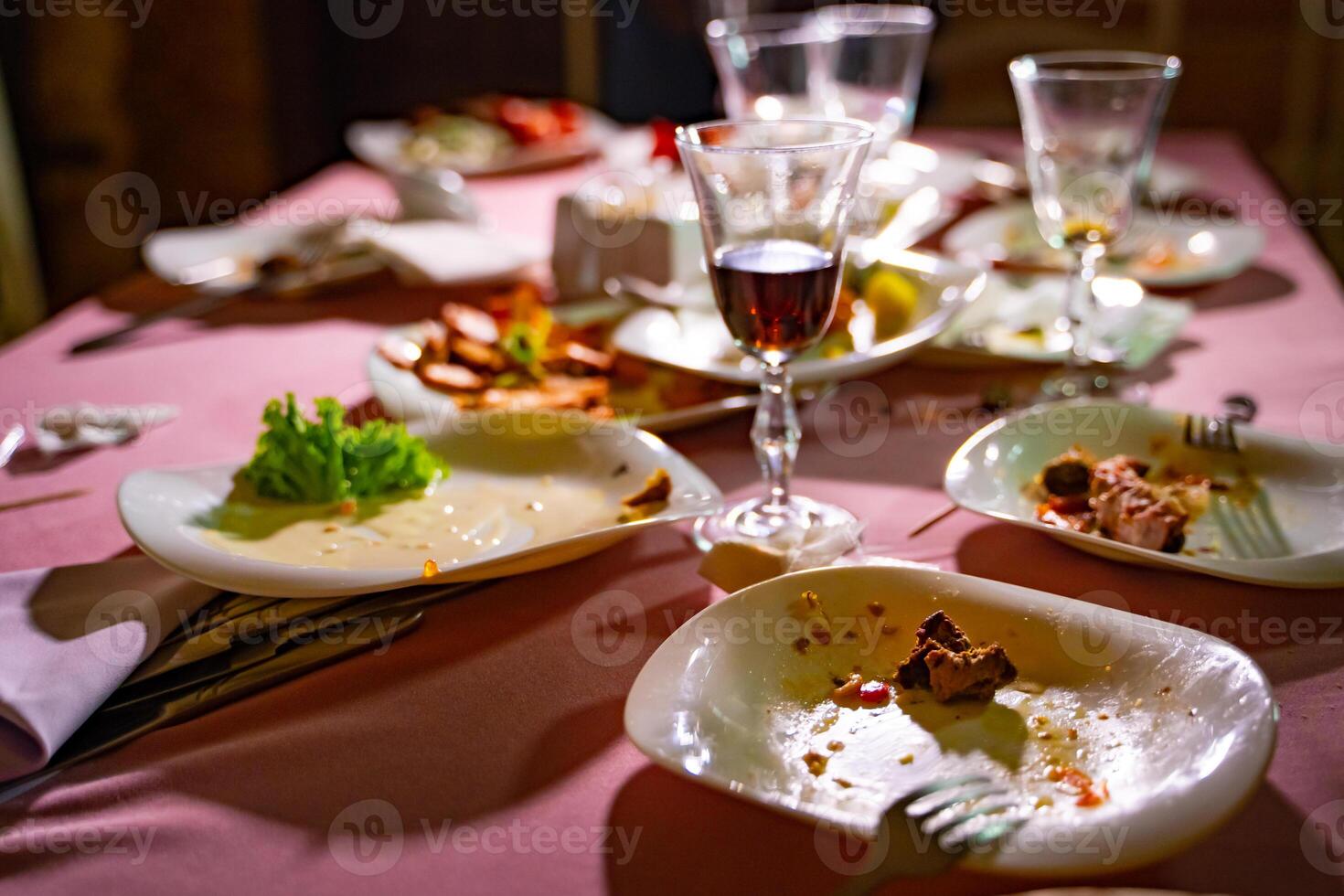 Empty dish after family dinner in restaurant. Party, celebration or healthy food concept photo