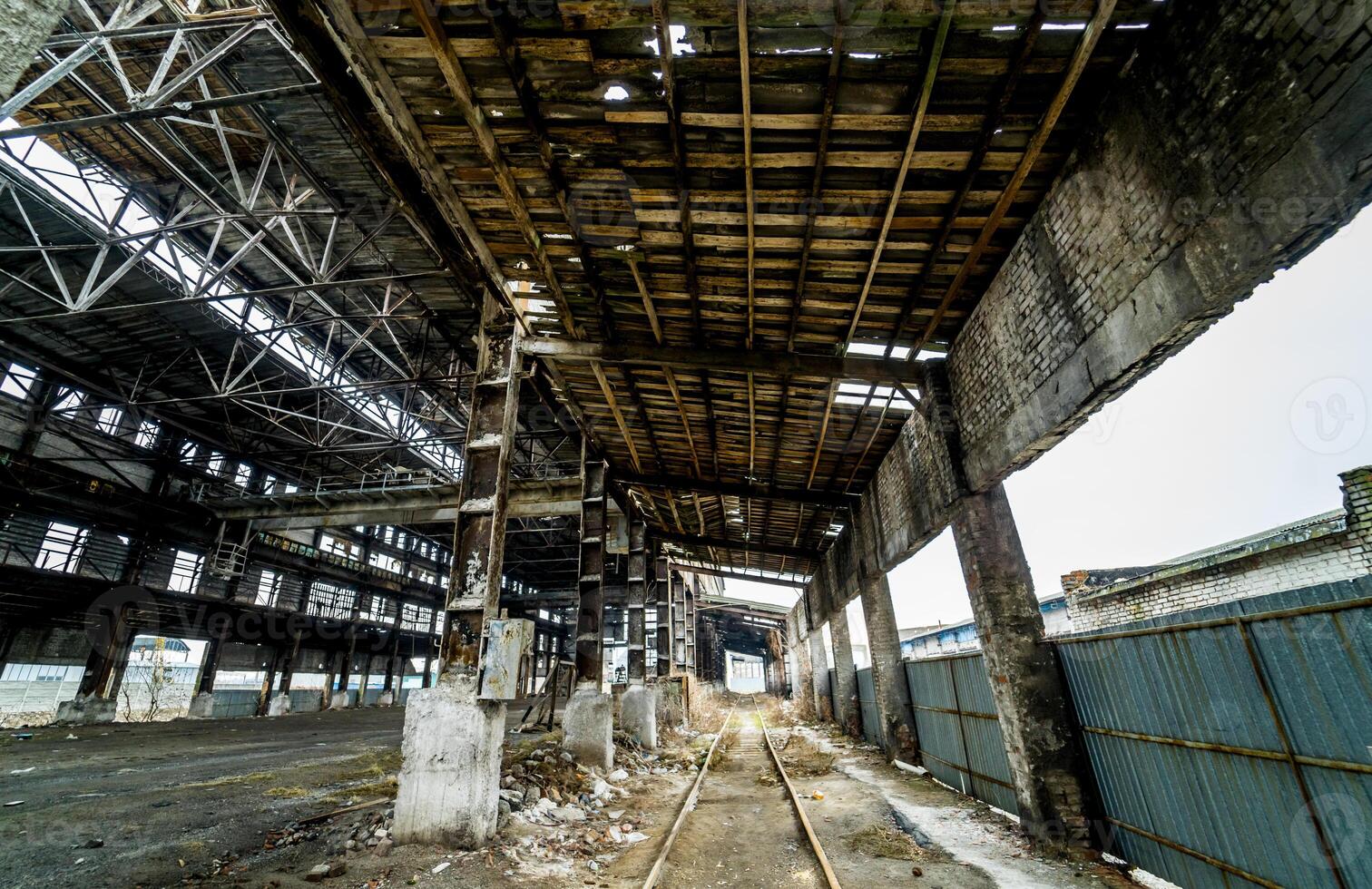 Abandoned ruined industrial factory building, ruins and demolition concept photo