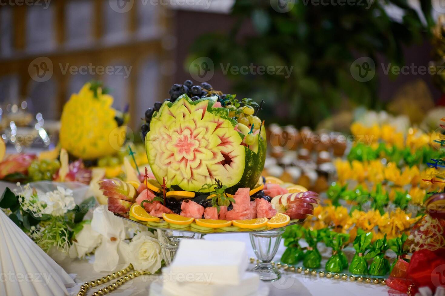 Decoration with fruit for child birthday. Sweet table with fruit, wedding catering, fruit bar on party photo