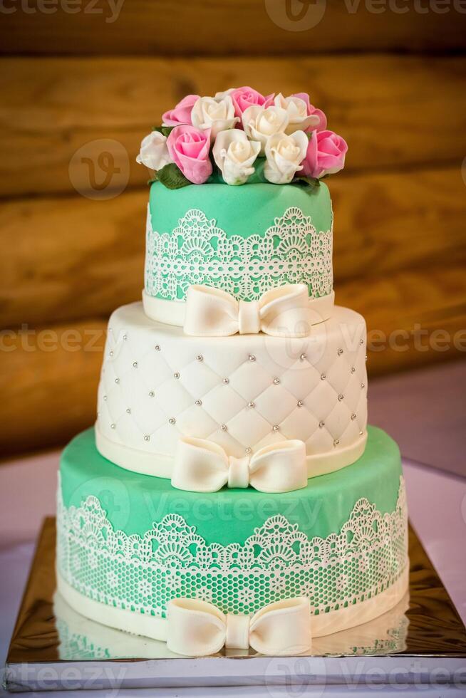 A traditional and decorative wedding cake at wedding reception photo