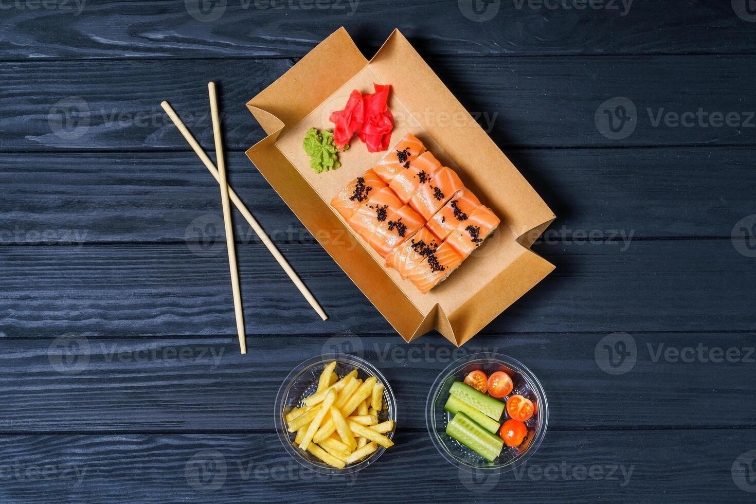 Food delivery, sushi rolls. Set of sushi in a cardboard box. Japanese Traditional Cuisine. photo