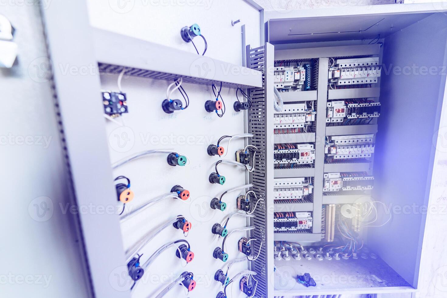 Electrical panel at a assembly line factory. Controls and switches. photo