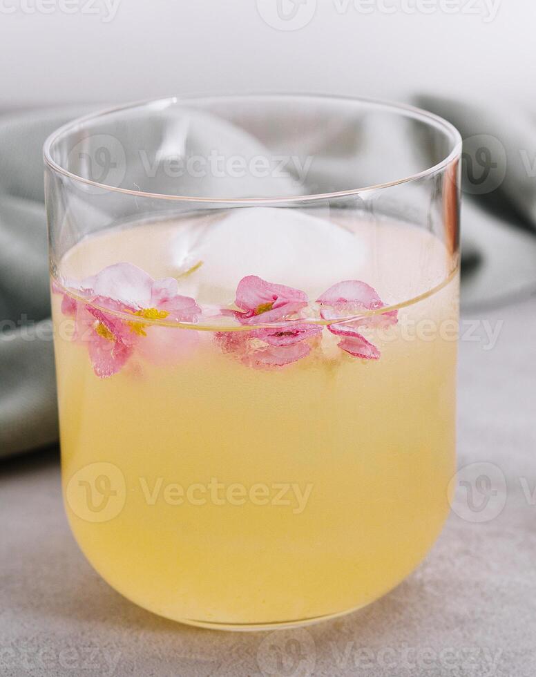 pineapple juice in glass with cubes Ice photo