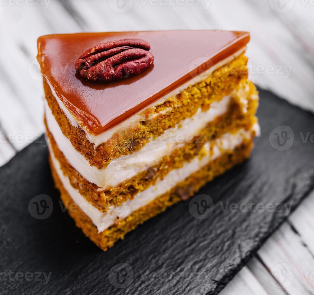 Delicious cheesecake with caramel and walnuts photo