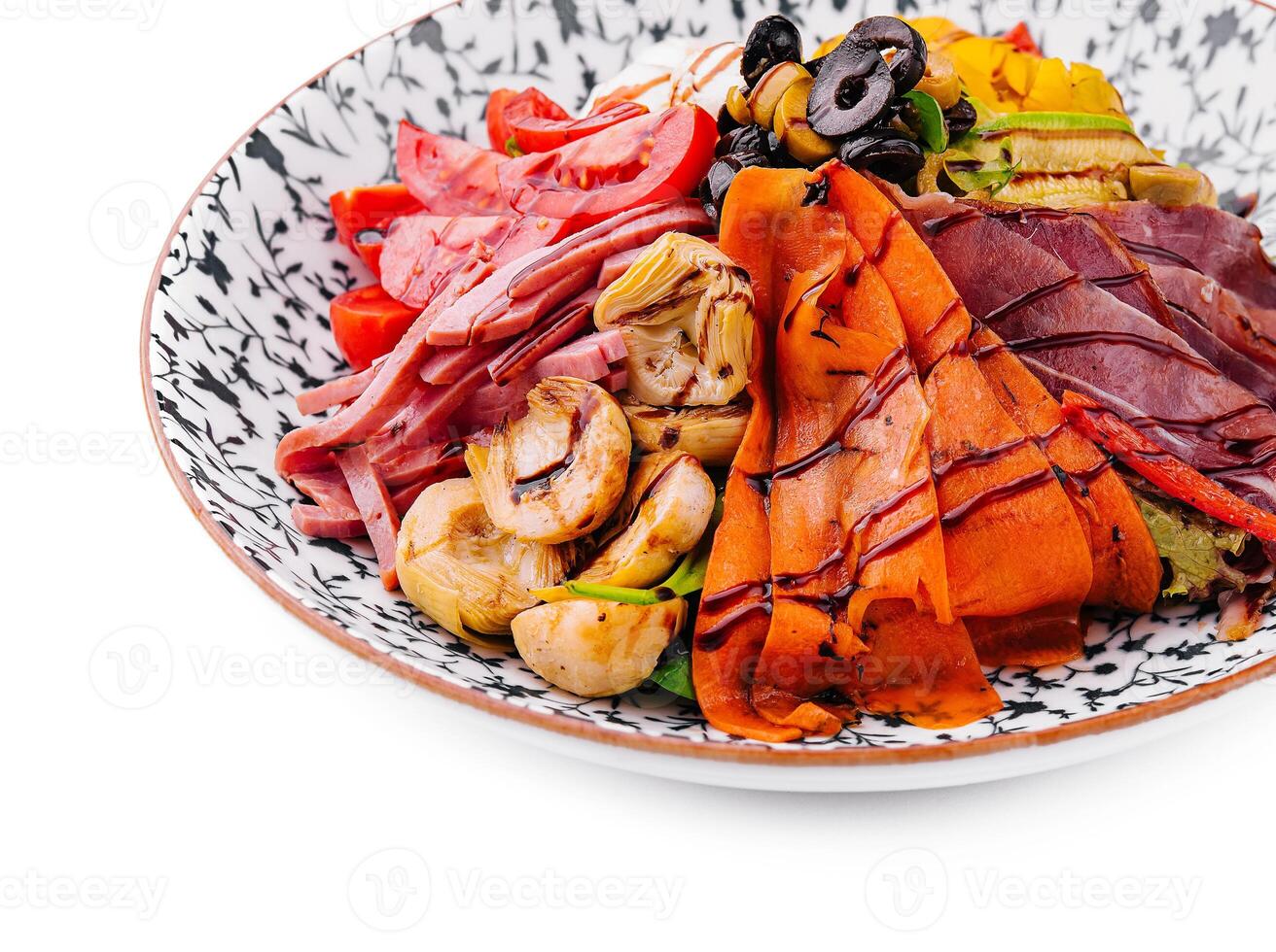 salad of various meats with mushrooms, carrots and lettuce leaves photo