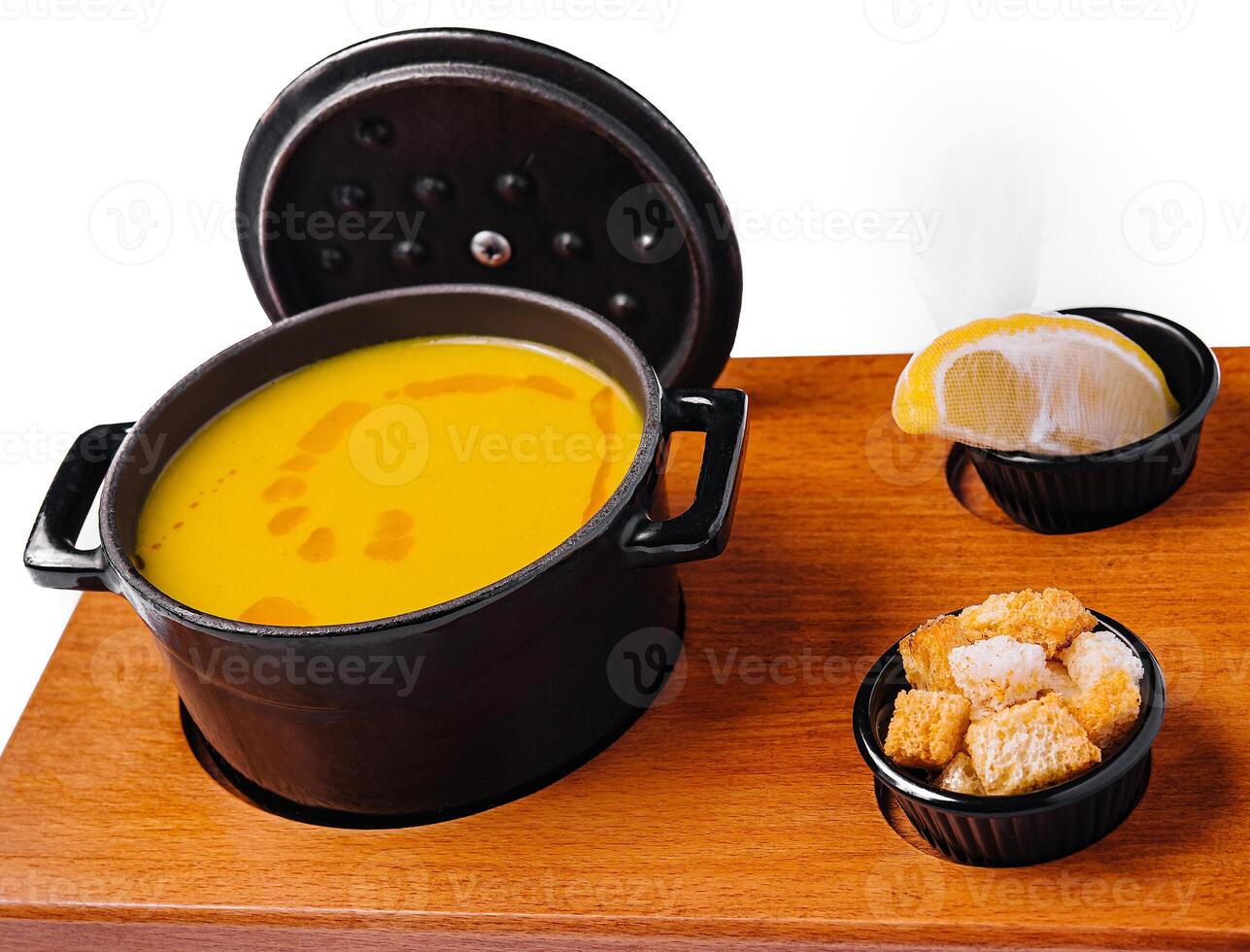 vegetable cream soup with croutons photo