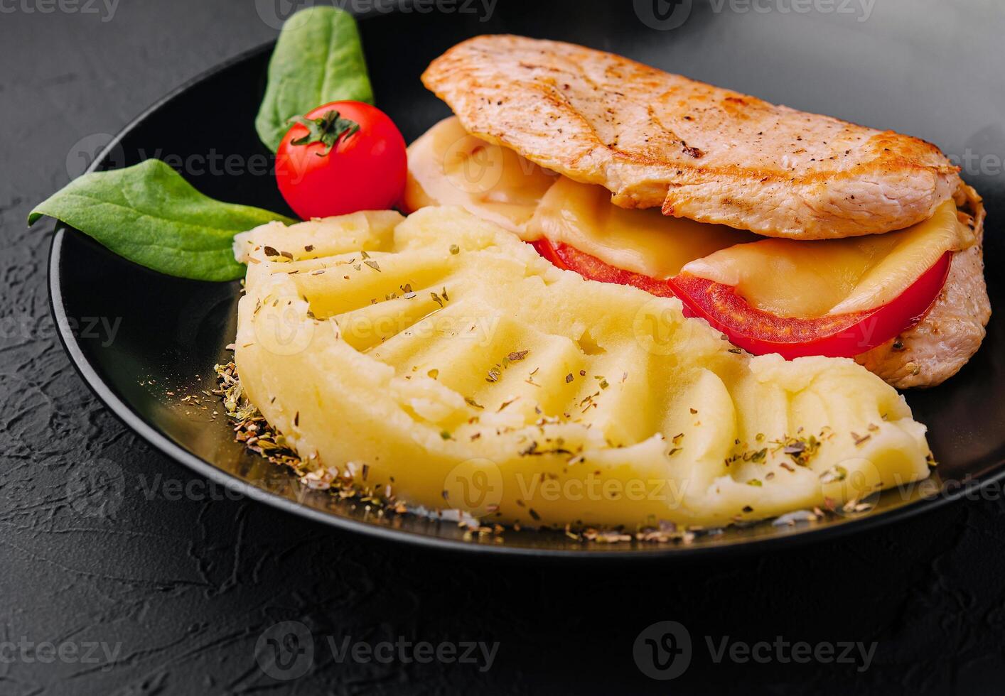 Baked chicken fillet with cheese and mashed potatoes photo