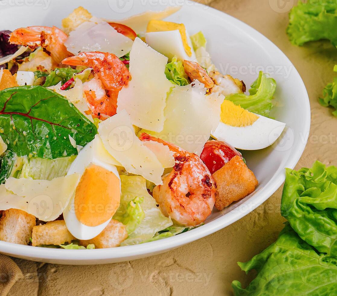 Chicken and shrimp caesar salad top view photo