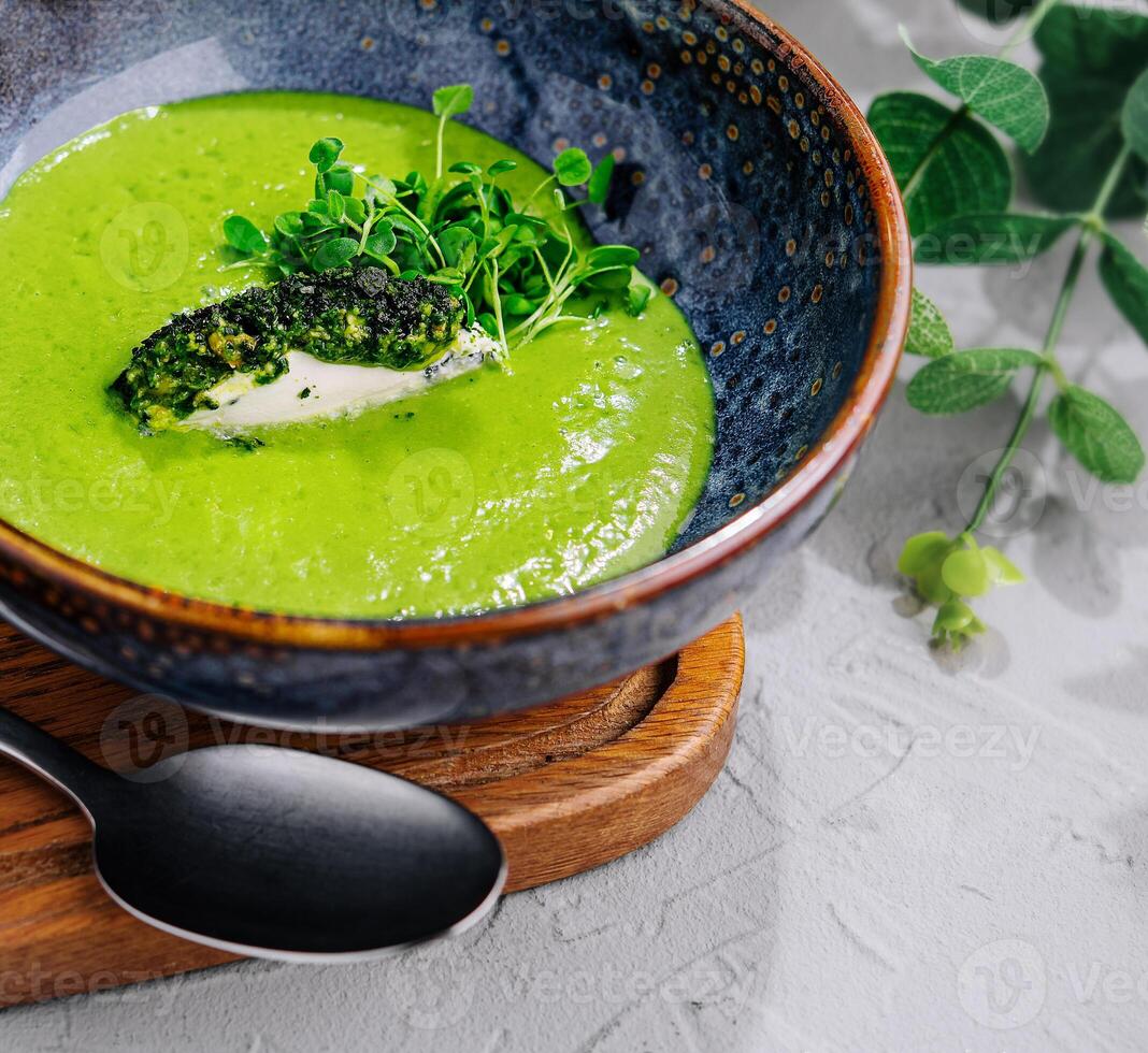 Broccoli, spinach cream soup in a bowl photo