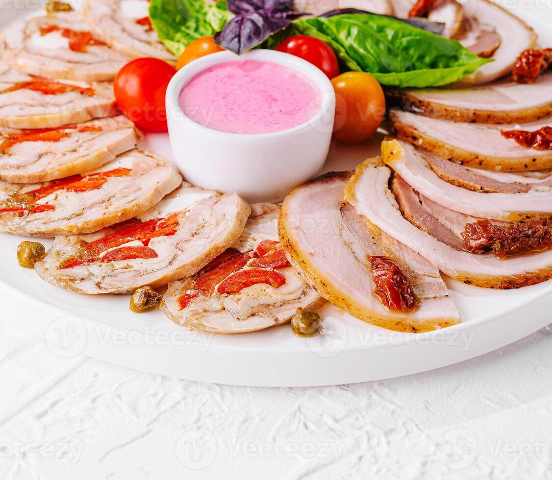 sliced meatloaf with peppers and capers photo