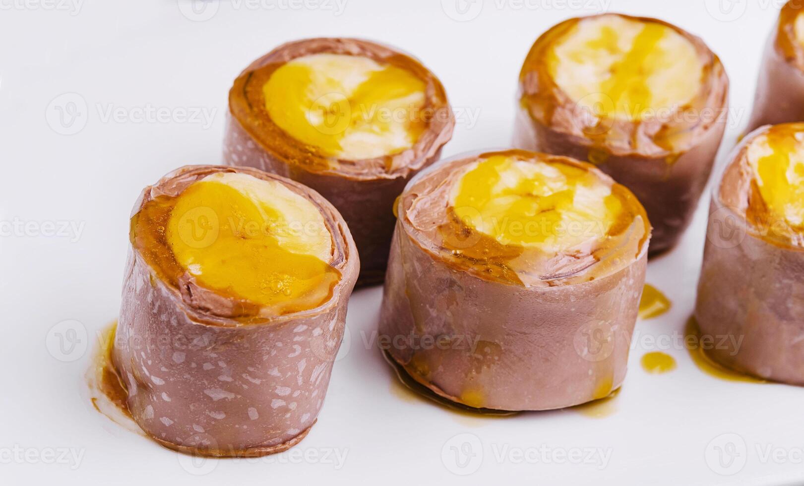 Chocolate Banana Pancake Rolls on White Plate photo