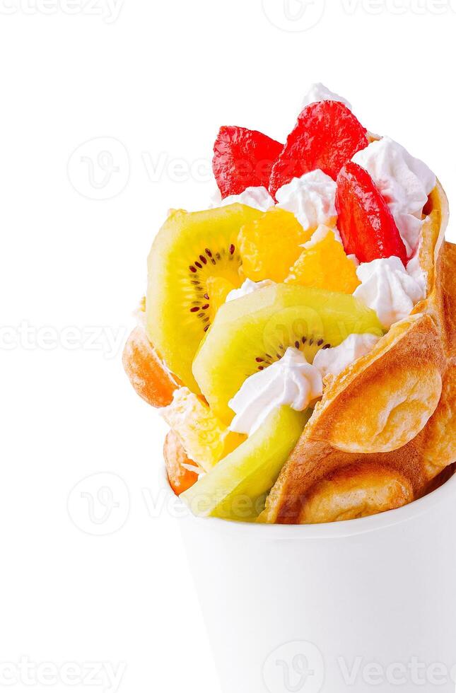 Bubble Waffle with kiwi, and whipped cream strawberry photo